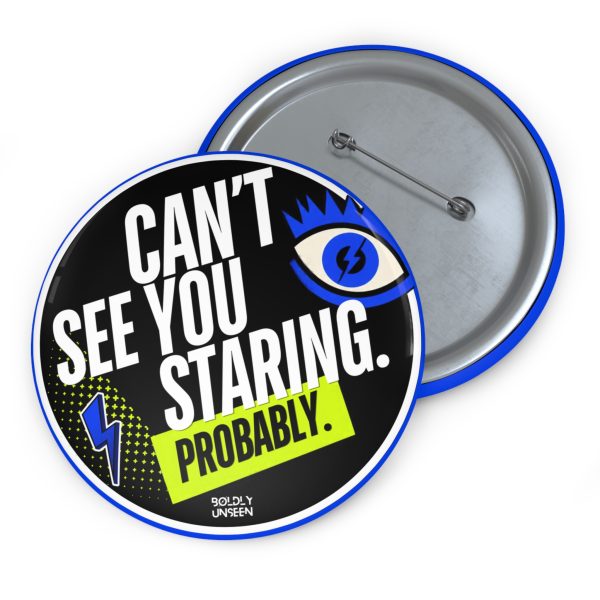 Can’t See You Staring. Probably. pin badge, black face with white lettering, cobalt-blue eye graphic and yellow Probably label, shown with its metal pin-back
